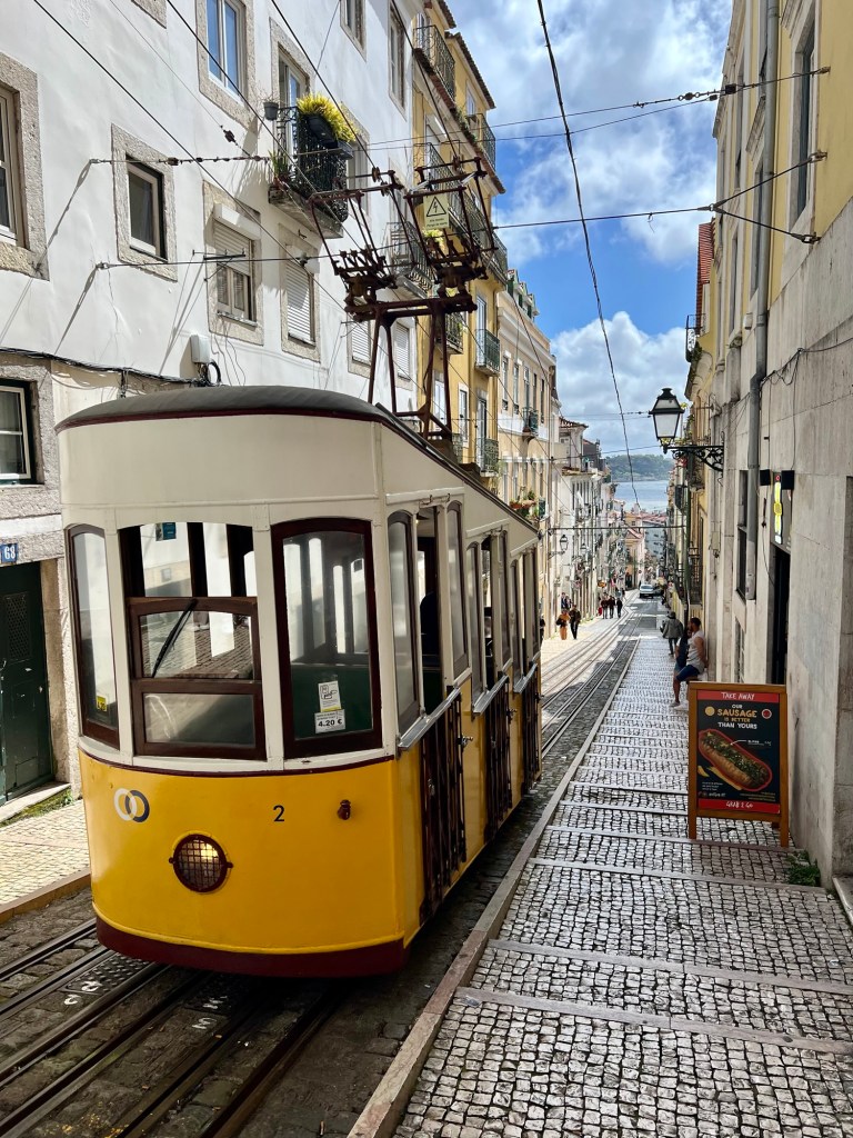 Yellow cable car in the streets of Lisbon
