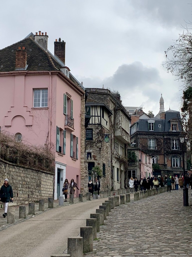 Colourful buildings on a cobblestone street in Paris