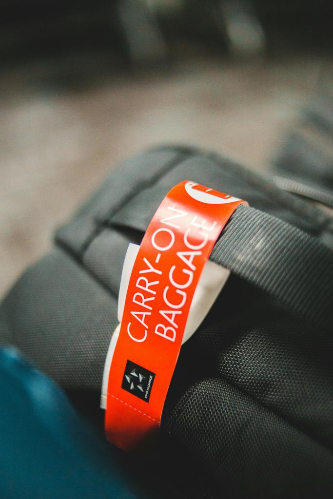 Carry on bag with focus on the carry on tag attached