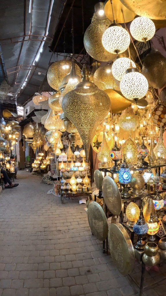 Copper lights and lanterns being sold in a market stall