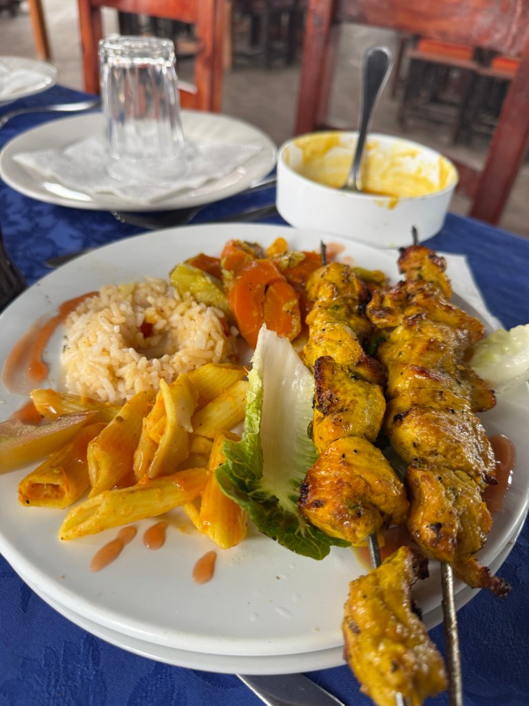 Plate of chicken skewers and rice