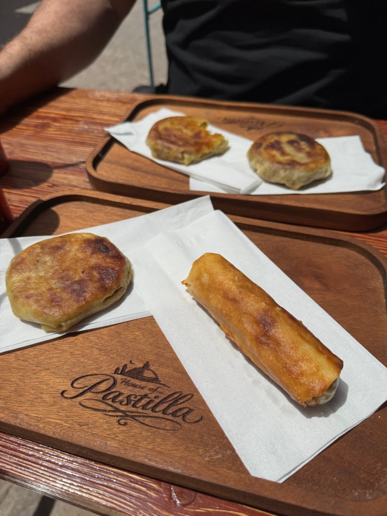 Wooden board with chicken pastilla pastries